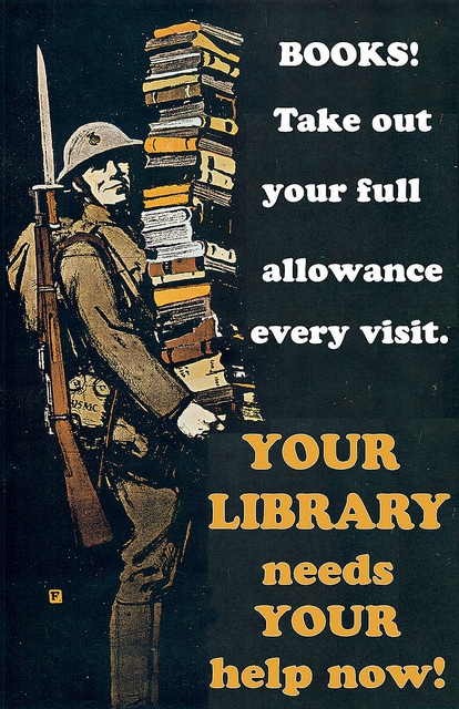 A soldier carrying library books. 