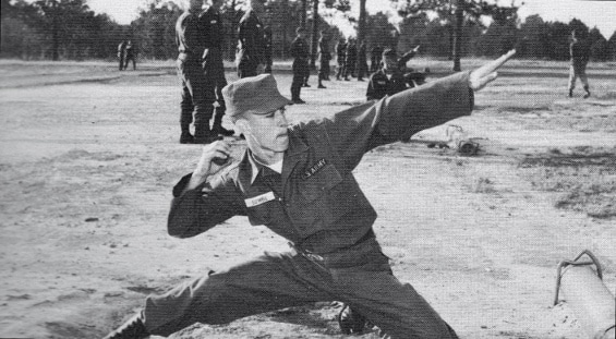 Vintage military boot camp pt training grenade throw.