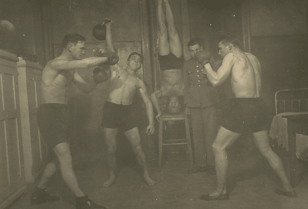 Vintage man amateur boxers boxing hitting speed bags.